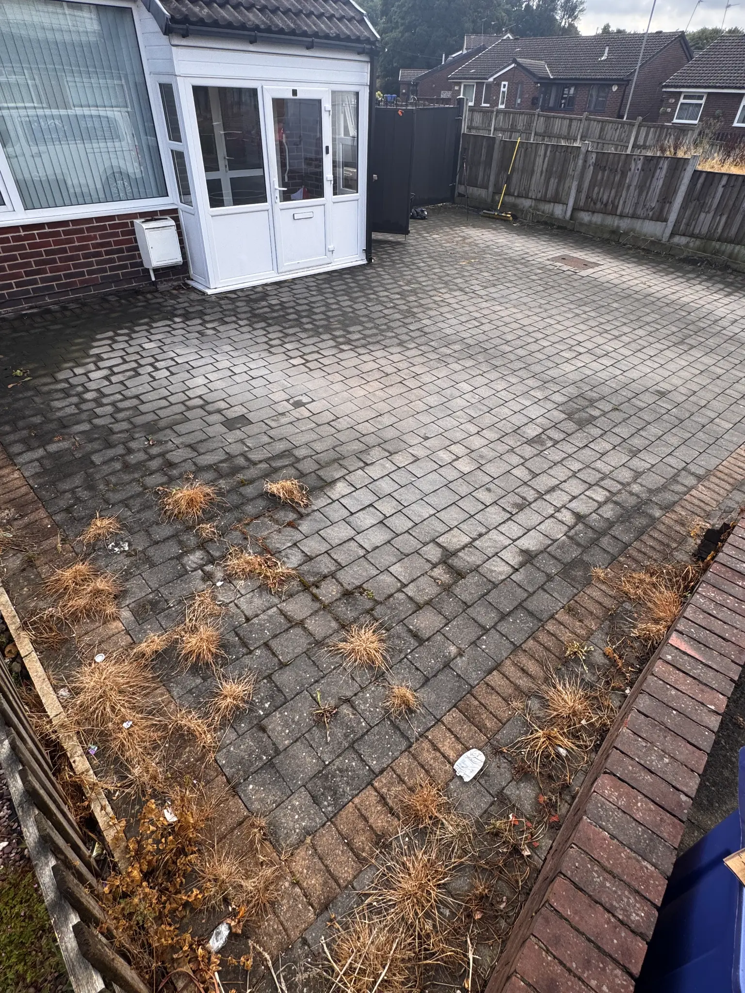 SkyVac gutter-vacuum system clearing debris from a residential gutter