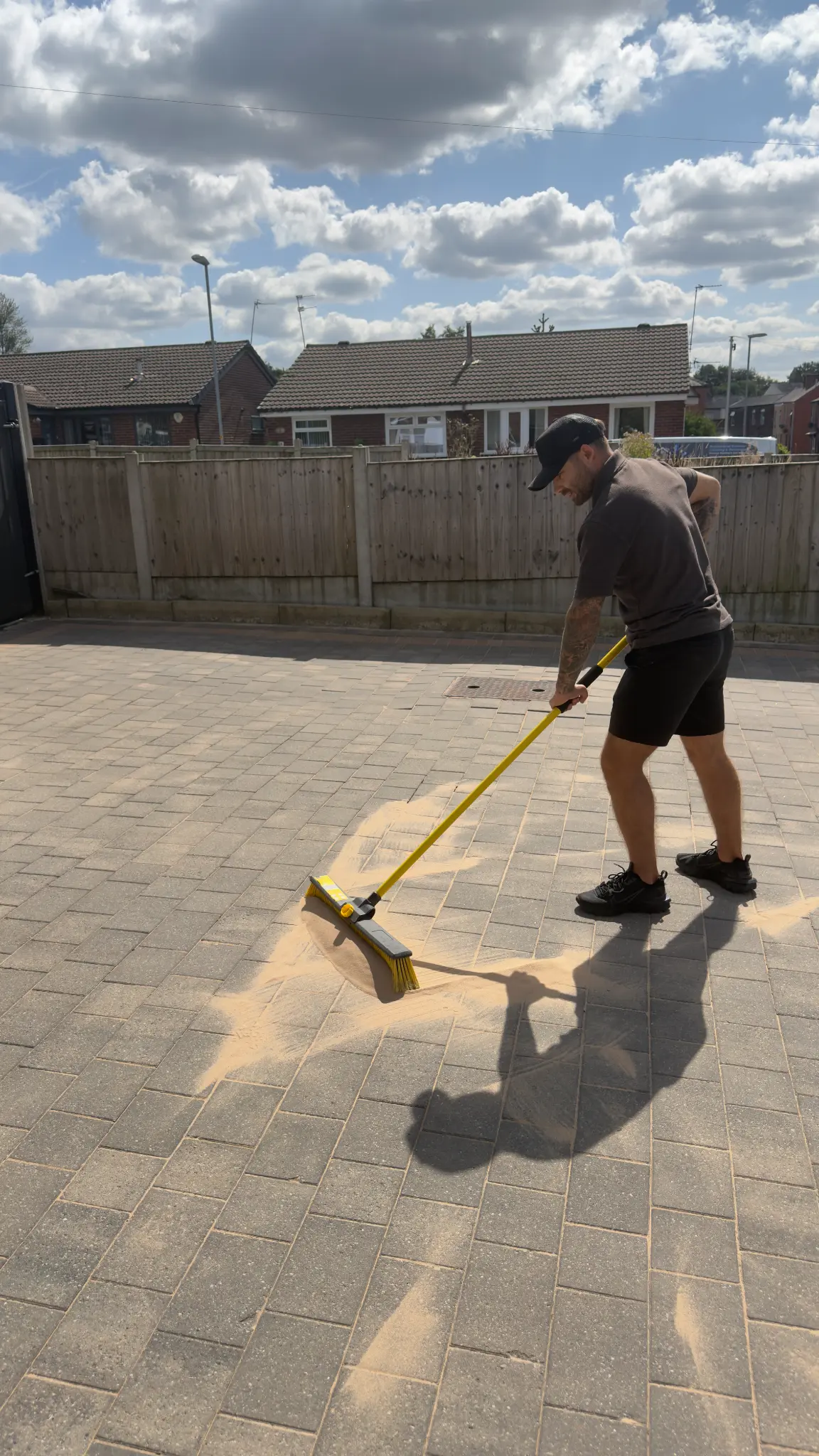 Driveway cleaning specialist using a rotary surface cleaner on block paving