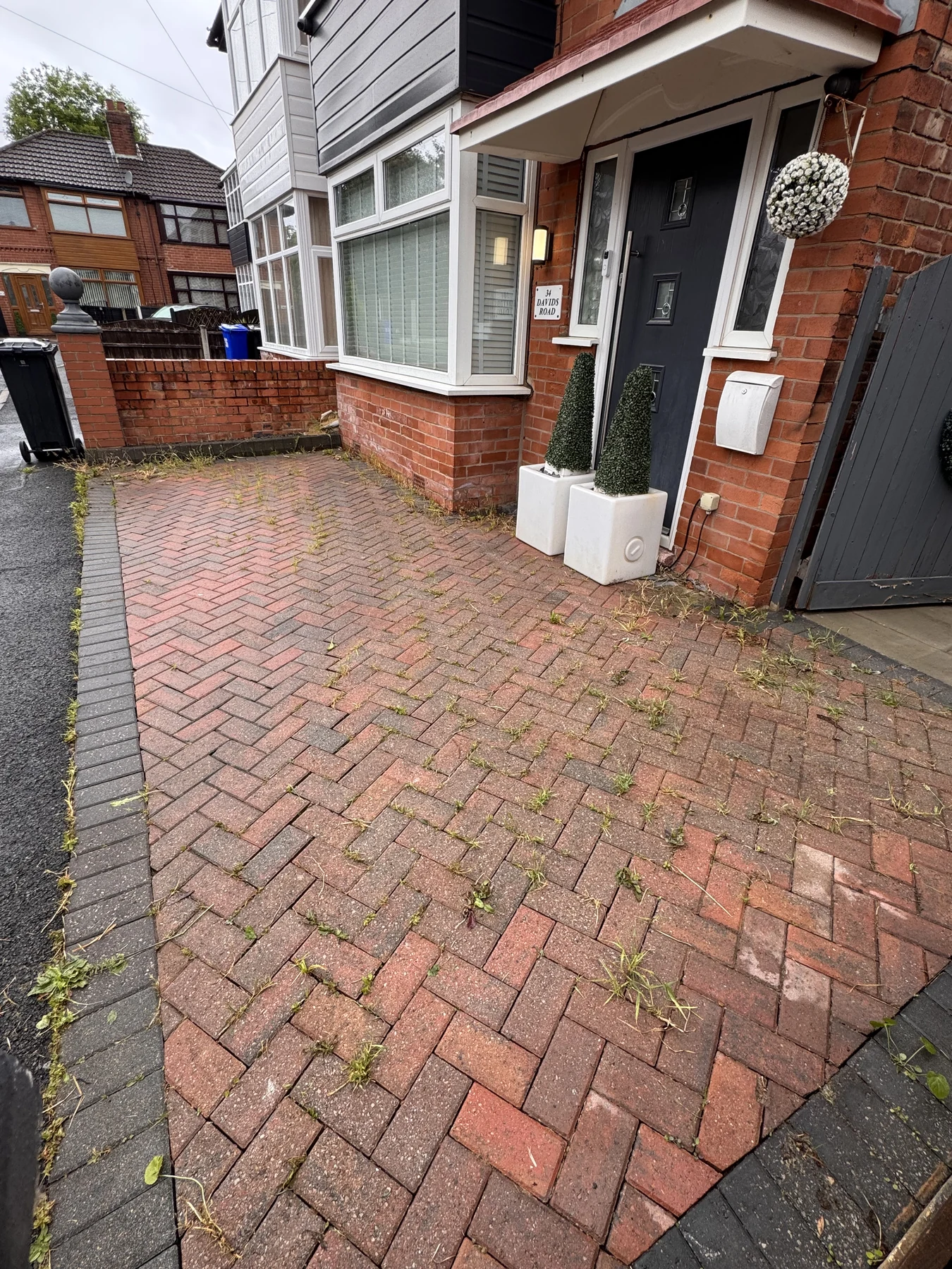Block-paved driveway before and after professional exterior cleaning before