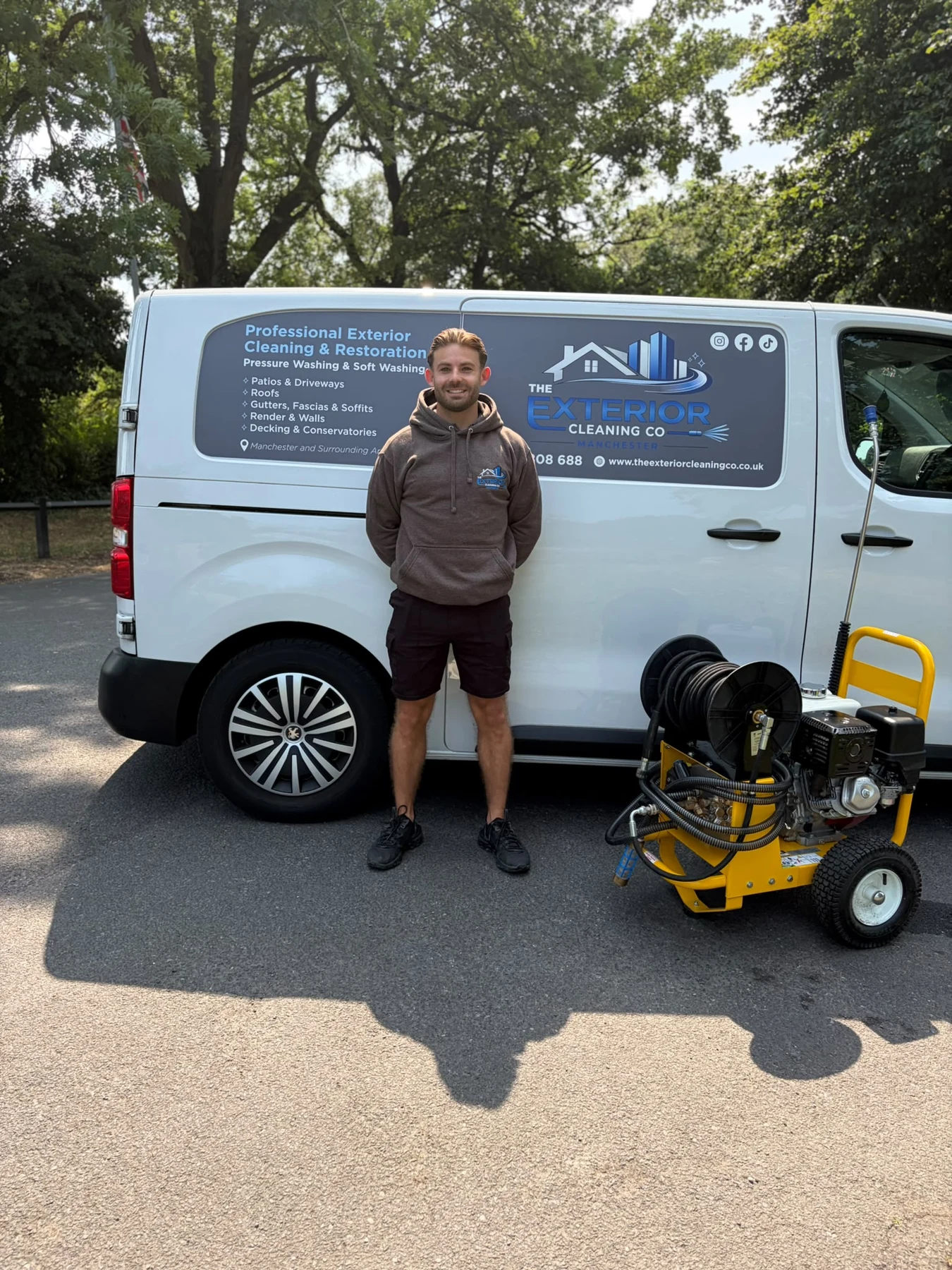 Lee, founder of The Exterior Cleaning Co. Manchester, with the branded van and professional cleaning machine
